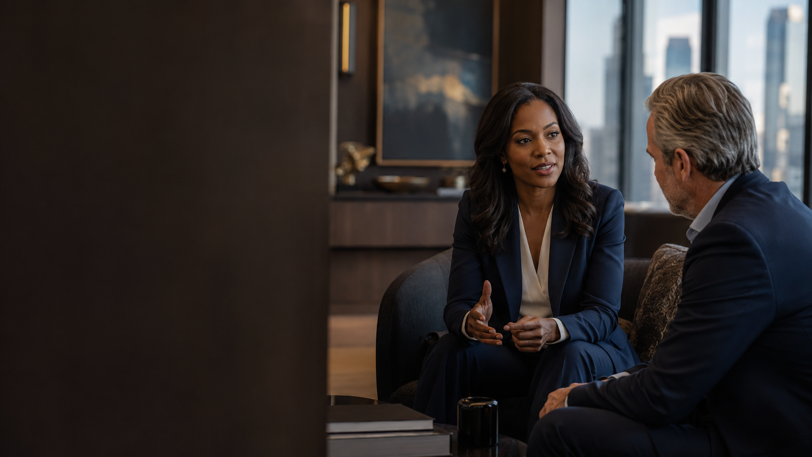 Black woman wealth advisor consulting with a client in an elegant office